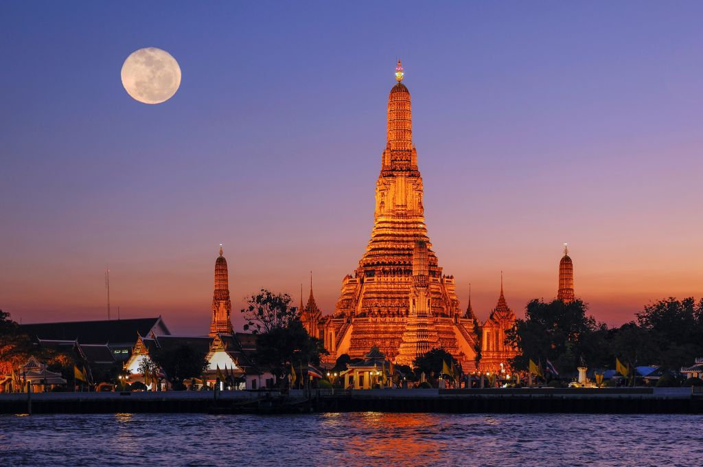 Wat Arun and Chao Phraya River, Bangkok. (Photo by: Christian Heeb/Prisma by Dukas/Universal Images Group via Getty Images)