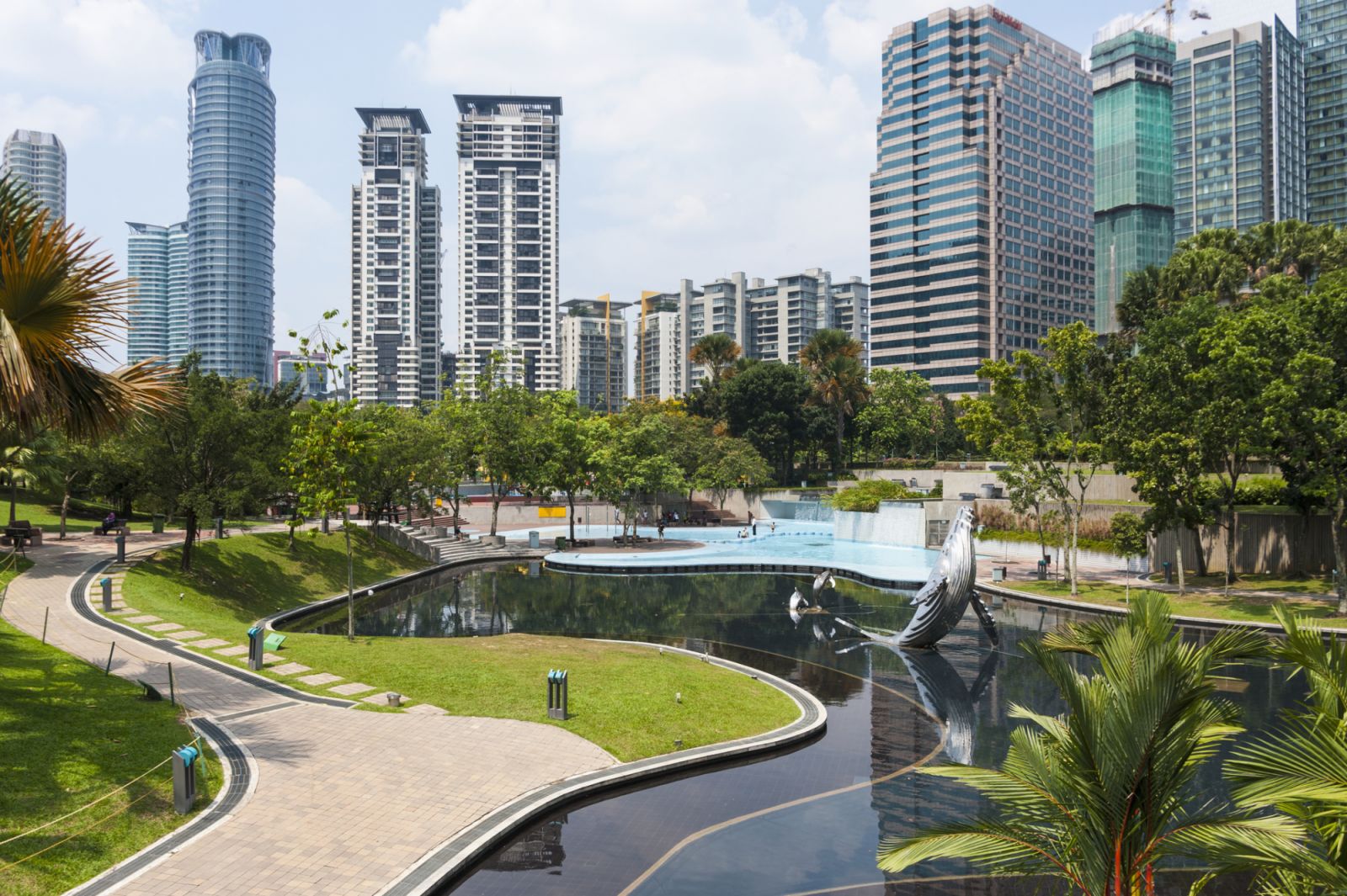 Lake and garden at the base of Petronas Towers, Kuala Lumpur, Malaysia